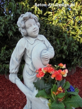 Garden Figure "Boy with a wheelbarrow" plant