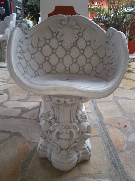 massive white concrete decorative garden armchair in baroque sty
